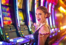 Young happy woman at a casino playing with slot machines